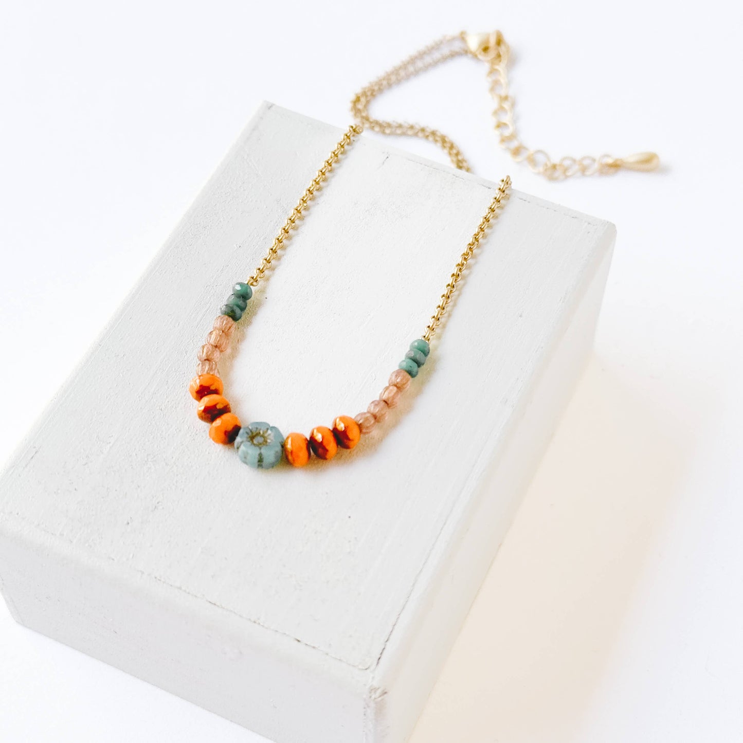 Tiny Blue Flower Necklace With Orange Beads
